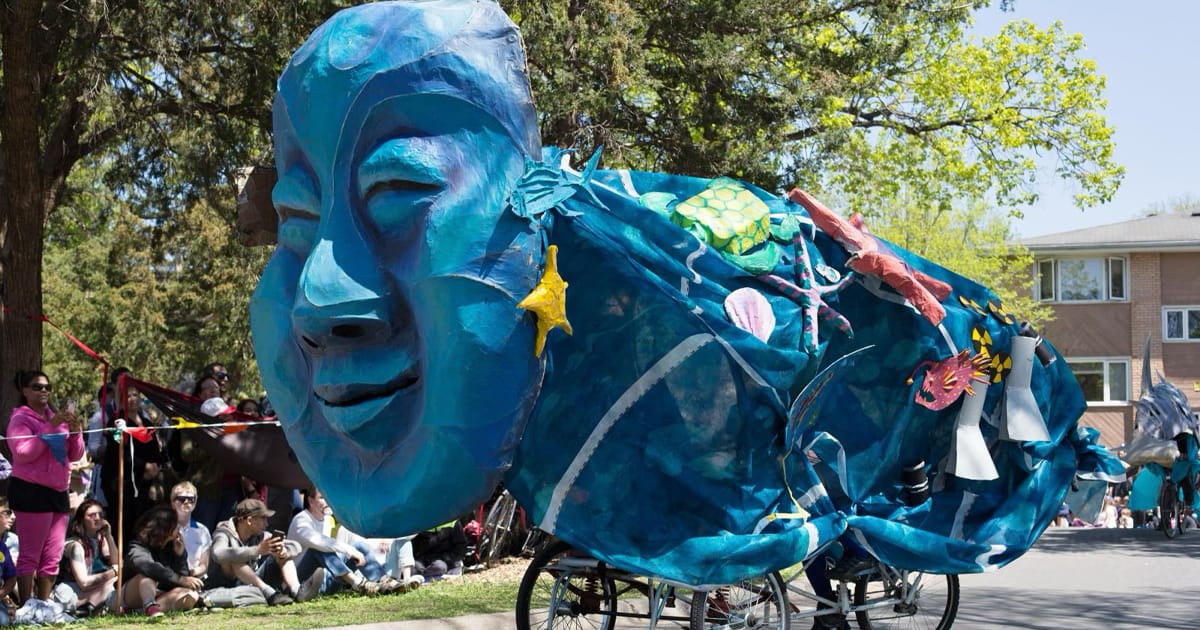 A puppet float representing the ocean winds through South Minneapolis during the 2025 MayDay Parade. © Gina Kelly / Alamy Stock Photo