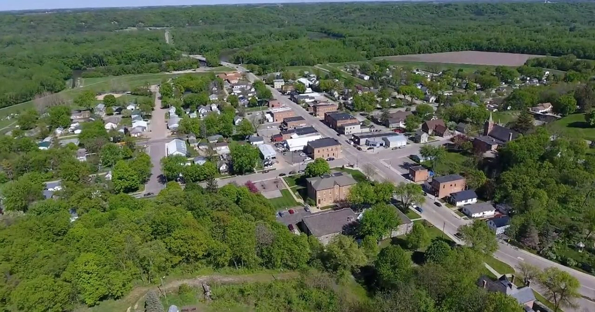 Historic downtown Henderson, Minnesota, along the Minnesota River Valley, showcasing preserved architecture, small-town charm, outdoor recreation, and quality of life in a growing river community.