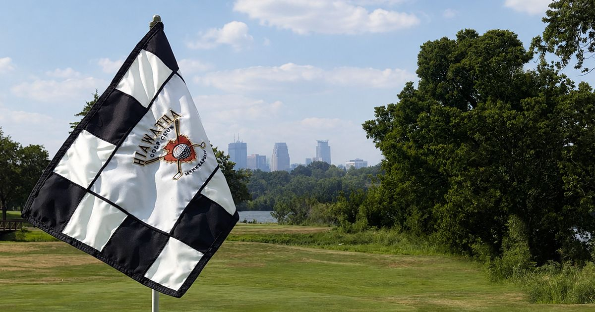 Hole 12 at Hiawatha Golf Course with the Minneapolis skyline in the background.